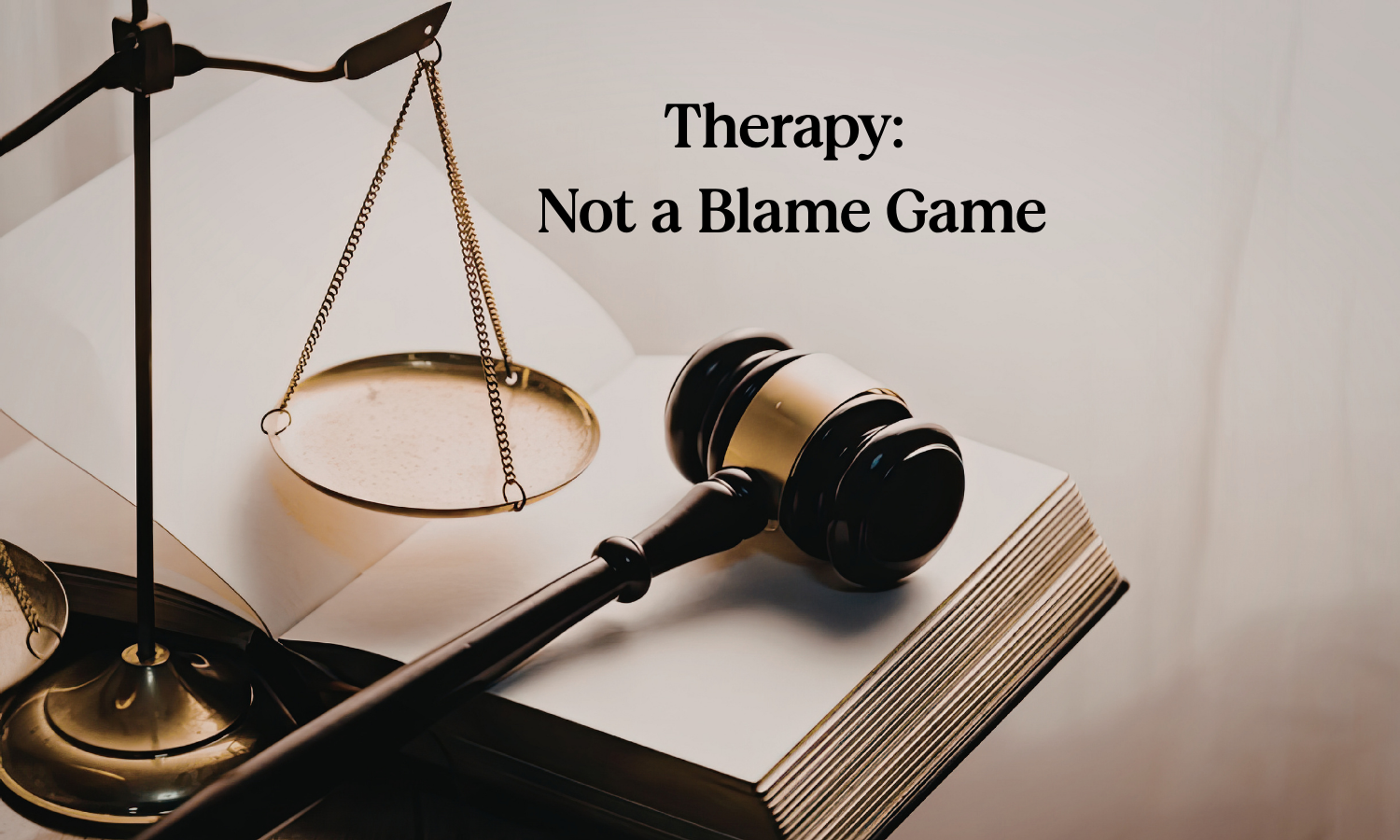 Gavel, Scales of Justice, and Notebook with the title, "Therapy: Not a Blame Game"