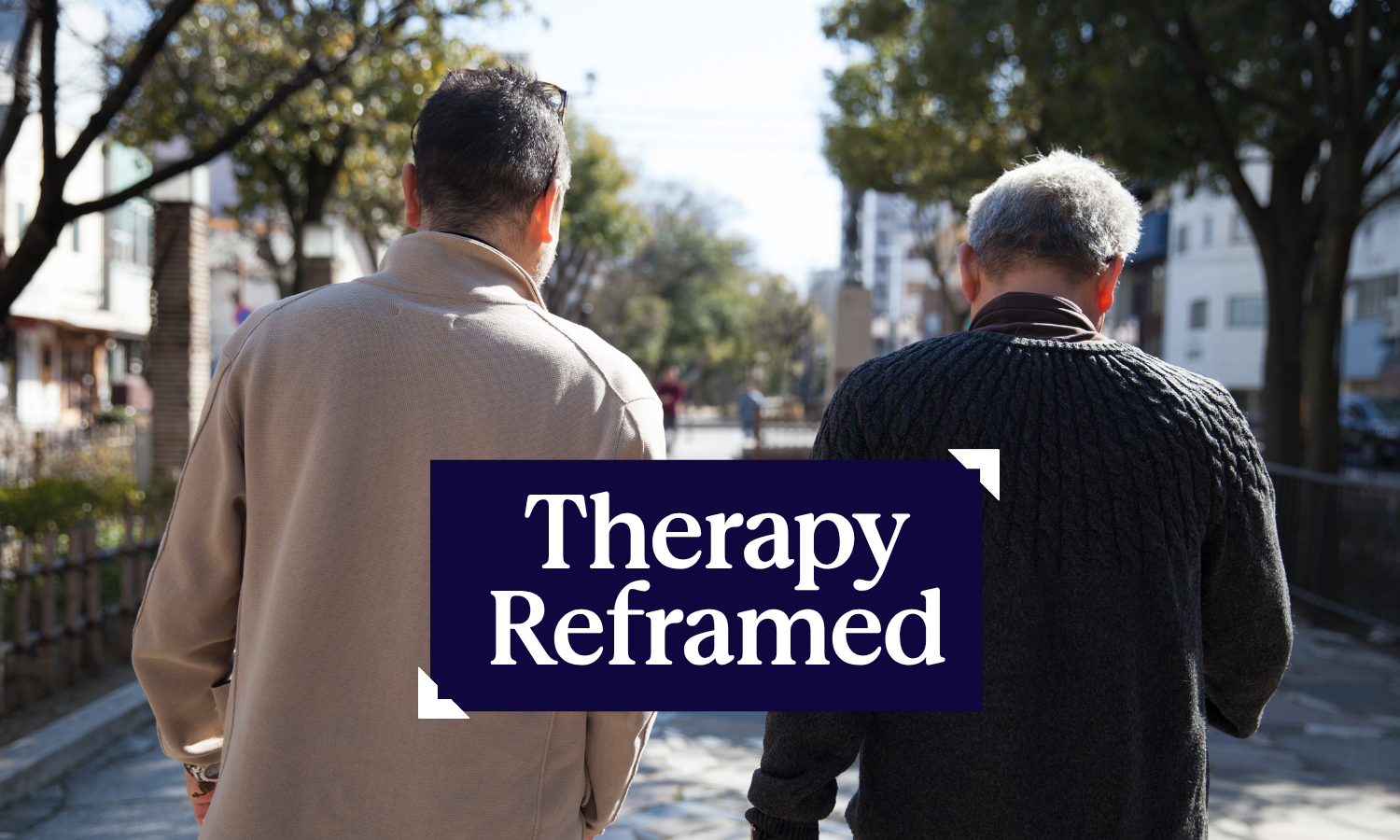Two men walking down a street, talking. Image includes the title, "Therapy Reframed"